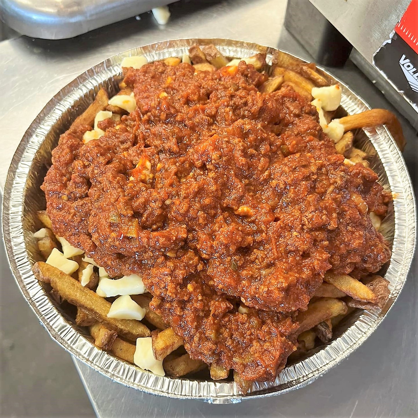 meat sauce piled on a poutine