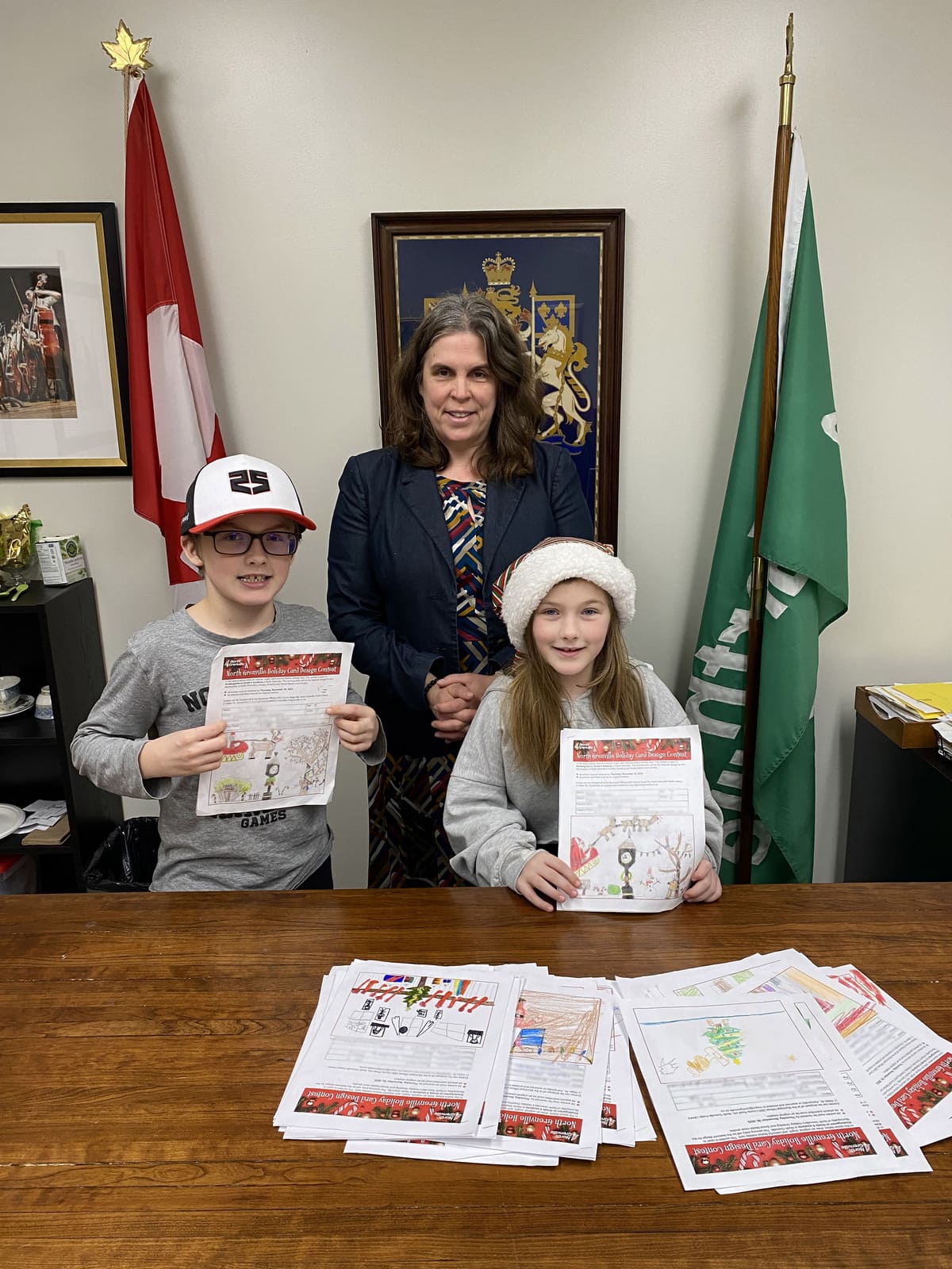 mayor with winners of the holiday card design contest