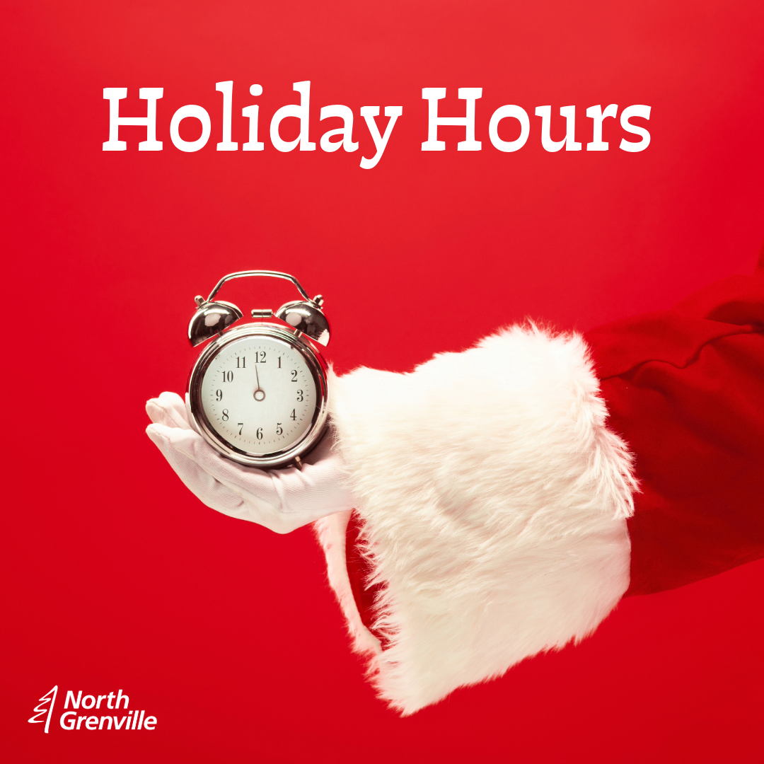 Santa's arm holding a clock. text says holiday hours.