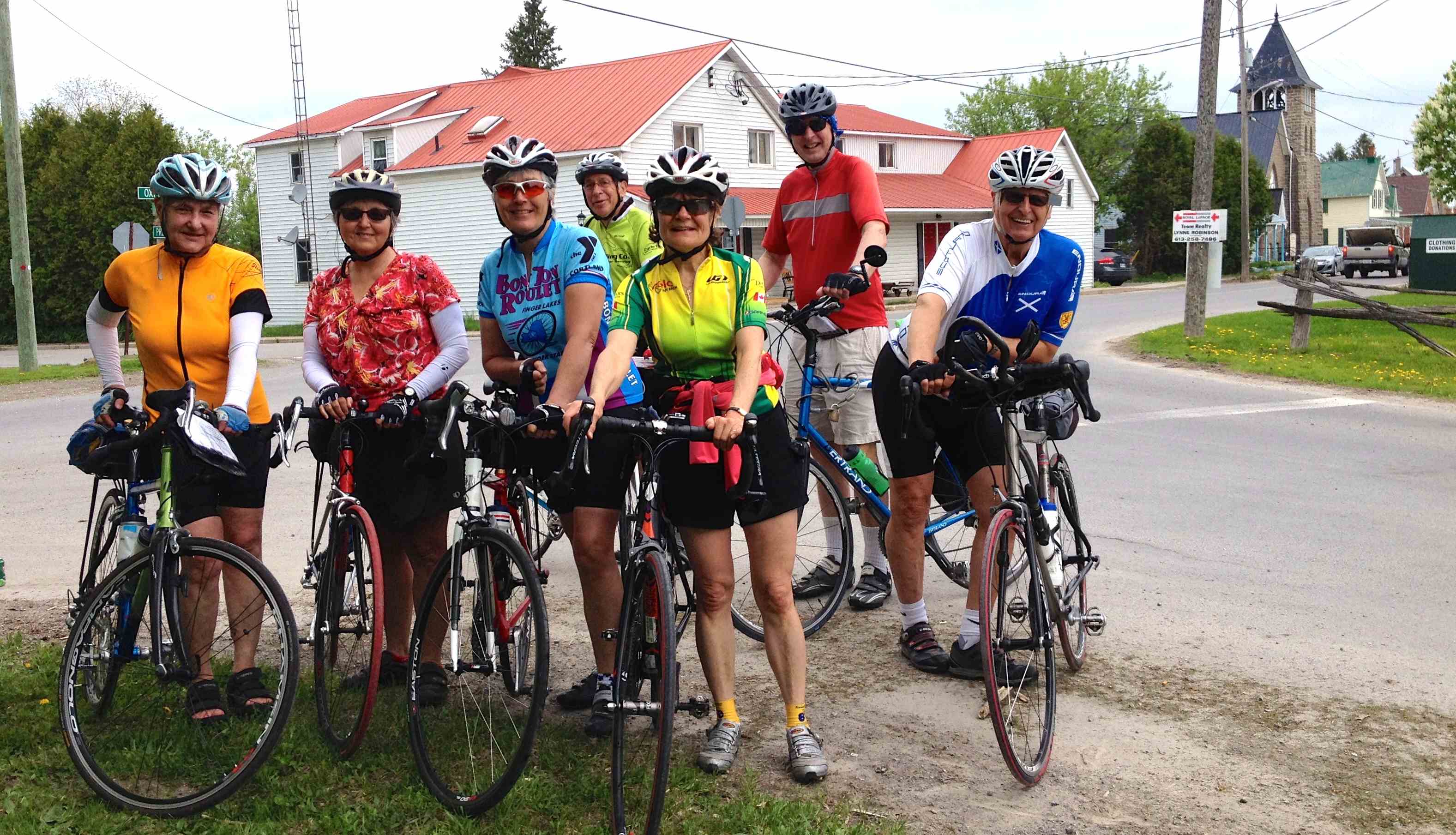 7 cyclists line up for a photo in Bishops Mills, North Grenville as part of MS Bike